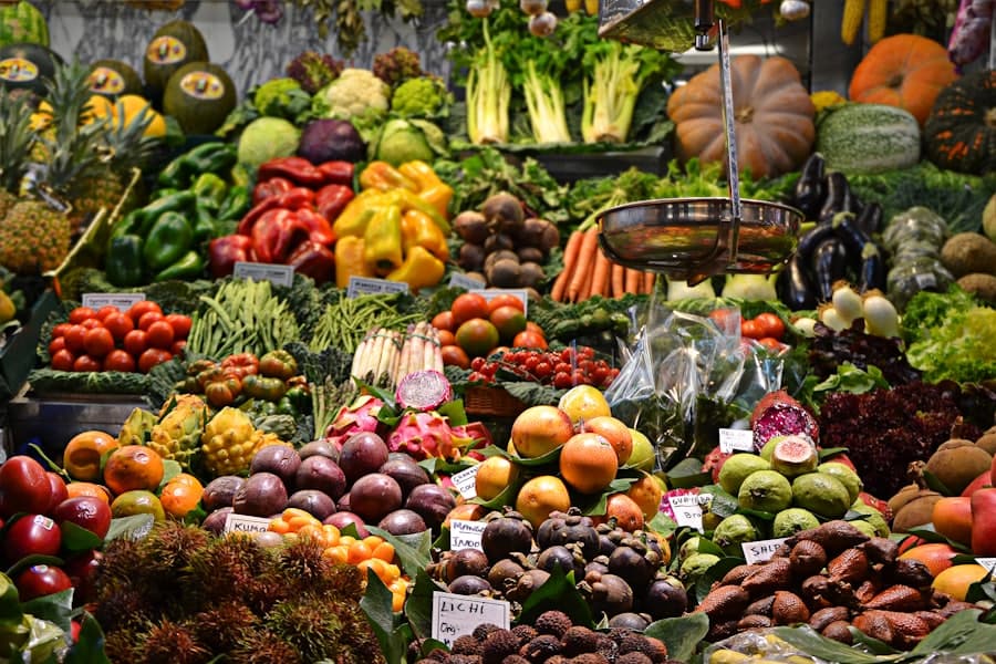 Outdoor market stalls with fresh produce under canvas awnings
